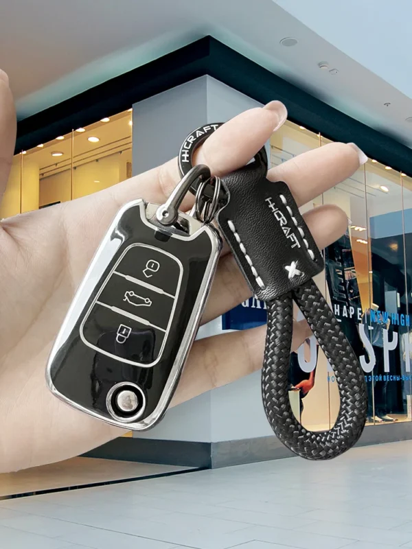Fashionable men's and women's pure handmade woven rope PU high-end leather simple anti loss multifunctional car keychain+car ant